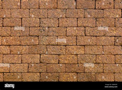 Laterite stone wall background Stock Photo - Alamy