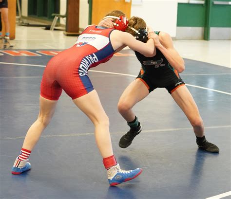 Men Wrestling Women: Male wrestler pinned by female wrestler