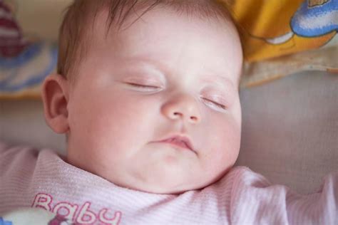 Premium Photo | Newborn baby girl sleeping in bed at home