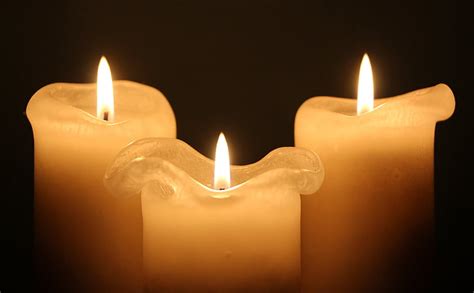 Royalty-Free photo: Three white lighted pillar candles | PickPik