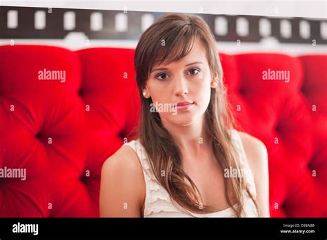 Sitting on red hi-res stock photography and images - Alamy