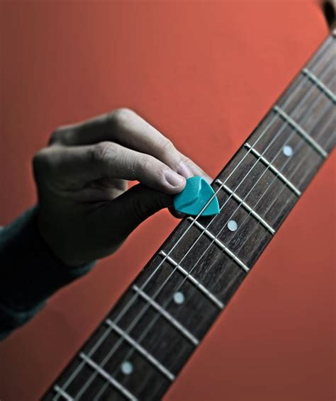 Guitar Pick Blue on a Guitar · Free Stock Photo