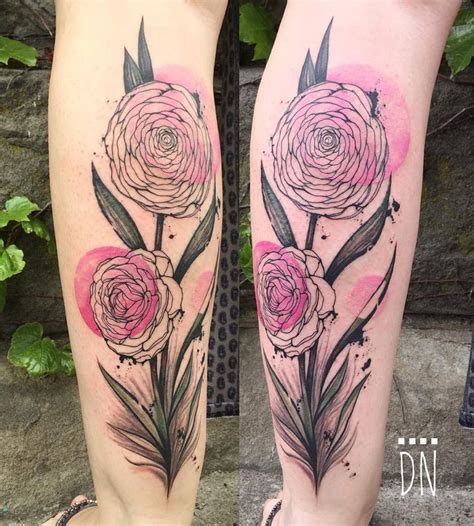 Freehand camellia flower tattoo on Jen's left calf.