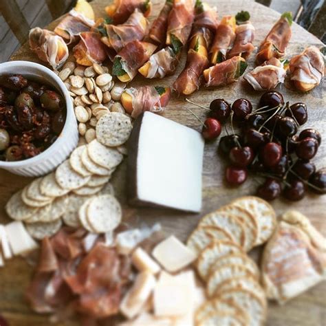 Cheese Board With Prosciutto Wrapped Peaches And Mint Recipe | The Feedfeed