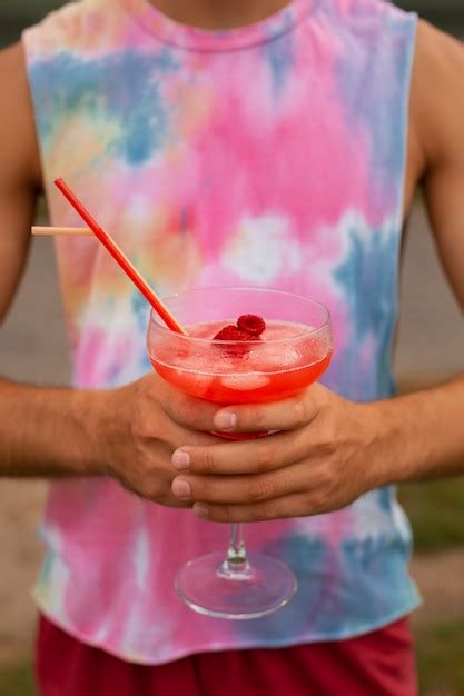 Free Photo | Portrait of man during summertime with 80's aesthetic and cocktails