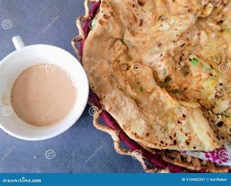 Indian Pakistani Breakfast Aloo Wala Paratha with Tea Stock Image - Image of pakistani ...