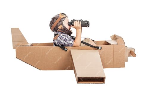 Premium Photo | Child with cardboard airplane