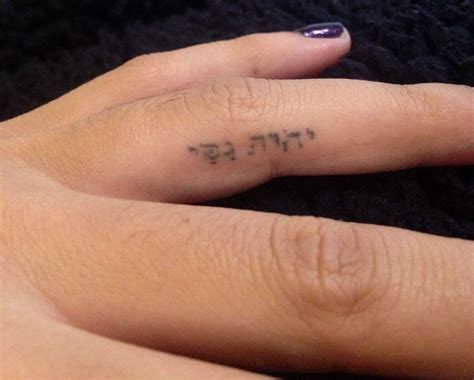 Finger tattoo. "Jehova-nissi" which means "God is my banner". Like the idea of word or phrase in ...