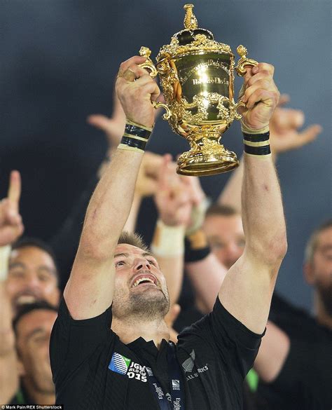 A proud Richie McCaw lifts the Rugby World Cup trophy aloft as New Zealand beat Australia 34-17 ...