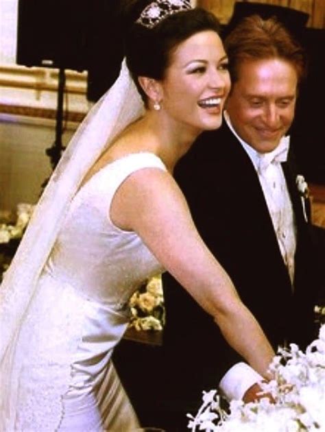 a bride and groom cutting their wedding cake