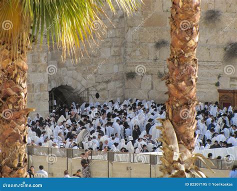 A Crowd of People Praying To God at the Wailing Wall of Jerusalem with ...