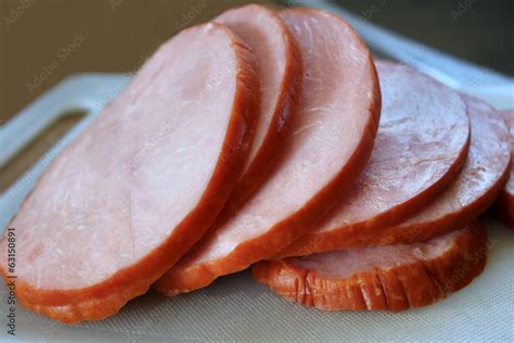 Thick slices of delicious ham on cutting board Stock Photo | Adobe Stock