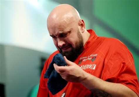 Emotional Jamie Hughes fights back tears at Alexandra Palace as he celebrates historic darts win ...