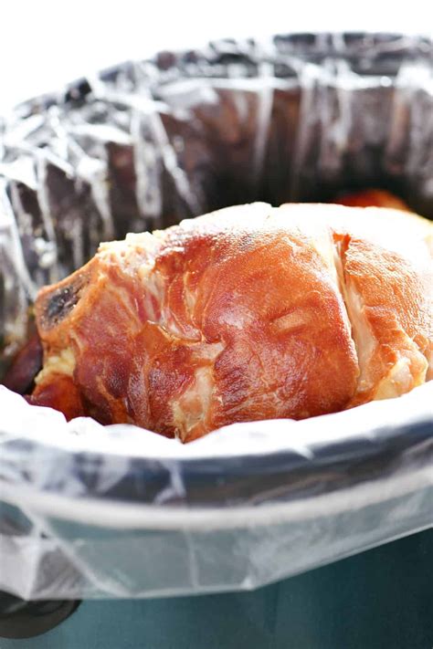 Wondering how to make Slow Cooker Ham? It's the easiest way to cook a smoked bone-in ham and it ...