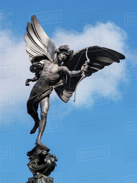 Statue of Eros in Piccadilly Circus; London, England - Stock Photo - Dissolve