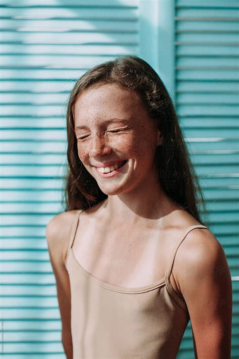 Girl Laughing With Closed Eyes With Freckles And Bright Personality by Liliya Rodnikova