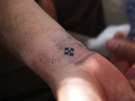 The Story Behind the Coptic Cross Tattoo | Egyptian Streets