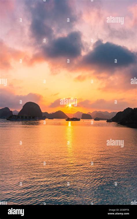 Amazing sunset over Ha Long Bay, Vietnam Stock Photo - Alamy