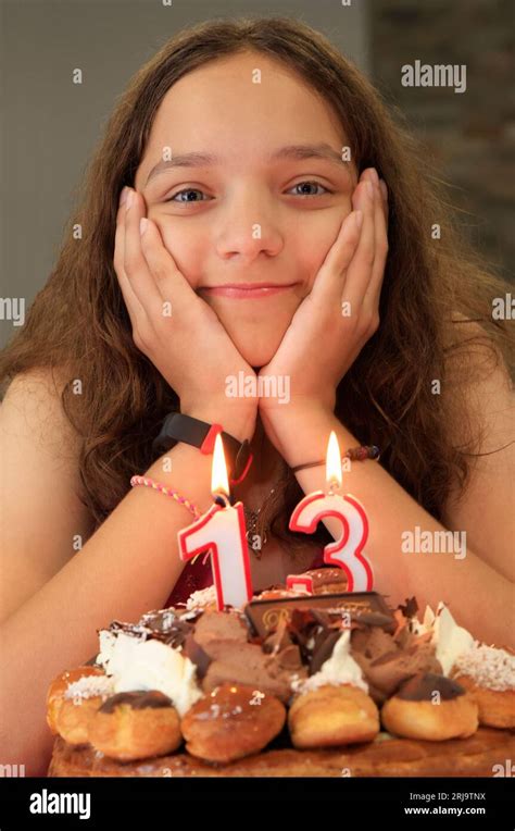Teenager girl portrait anniversary including birthday cake and candles Stock Photo - Alamy