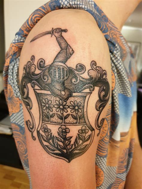 First tattoo, about one year old now. Family crest done by Nima, Tigr Tattoo, Oslo : r/tattoos