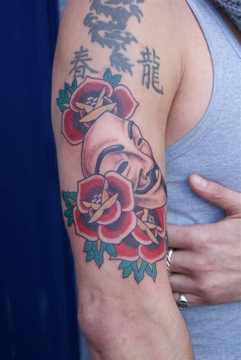 Tjitse de Vries Tattoo: Old school roses and a Guy Fawkes mask