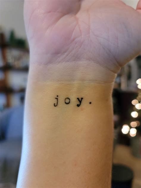 Joy tattoo | Joy tattoo, Side wrist tattoos, Discreet tattoos for women