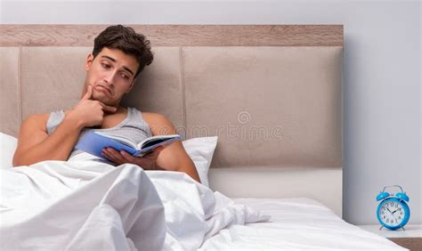 Man Reading Book in the Bed Stock Image - Image of restless, night ...