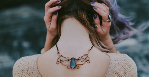 Woman Wears Gold-colored Blue Gemstone Pendant Necklace · Free Stock Photo