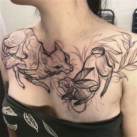 Abstract style black ink fox with little rabbit tattoo on chest - Tattooimages.biz