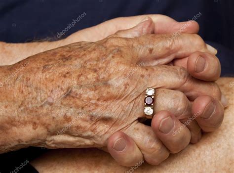 Old couple holding hands — Stock Photo © AOosthuizen #5482102