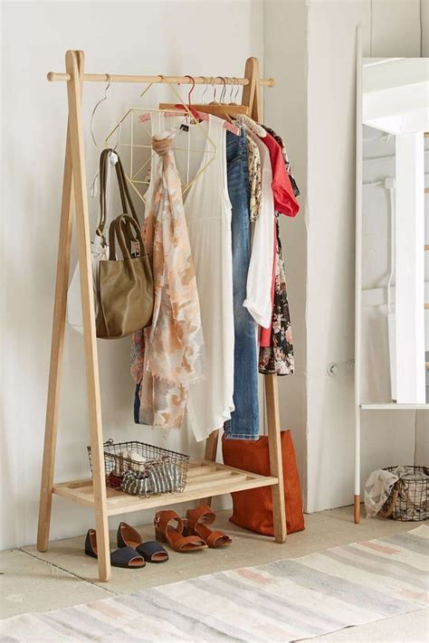 Urban Outfitters Wooden Clothing Rack | Wood clothing rack, Wood ...