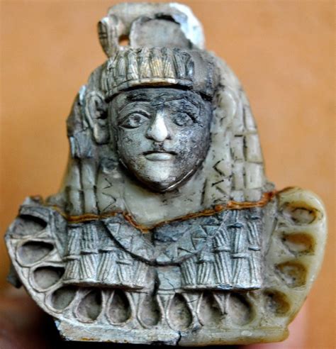 Carved ivory plaque of an Egyptian-looking woman. Note the black burn marks. Neo-Assyrian period ...