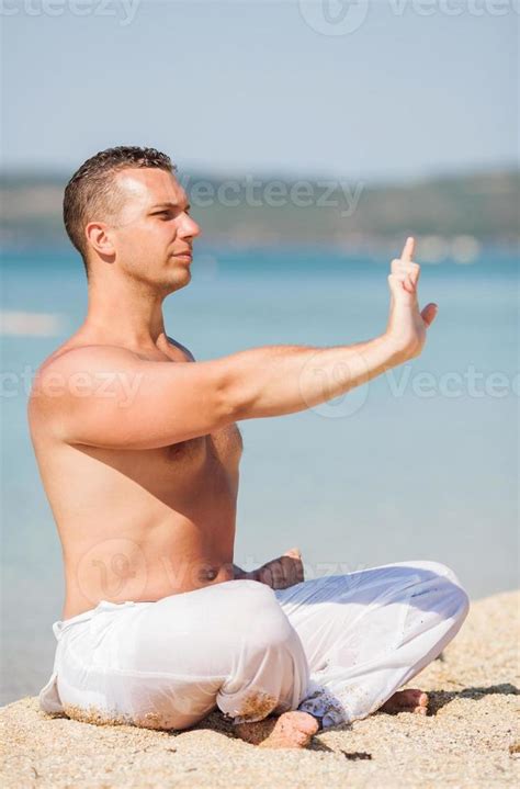 Meditation on the beach 14227189 Stock Photo at Vecteezy