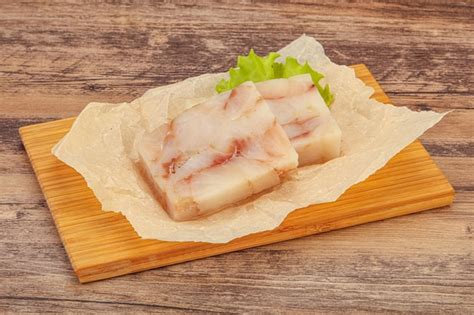 Premium Photo | Raw pollock fish fillet for cooking