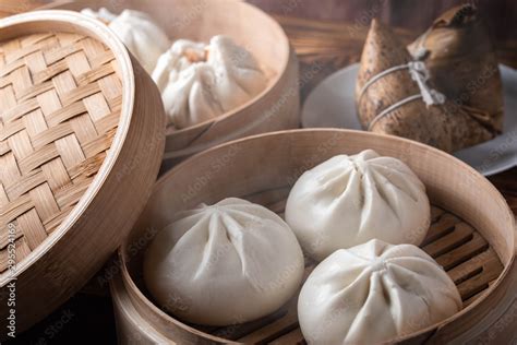 chinese steamed bun in traditional bamboo steamer Stock Photo | Adobe Stock