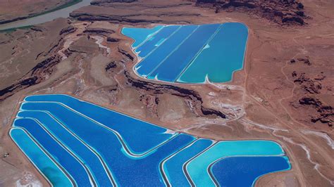 5.5K stock footage aerial video of flying away from potash ponds, Moab ...