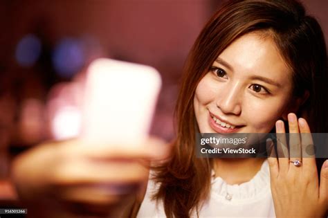 Young Women Show Diamond Rings High-Res Stock Photo - Getty Images