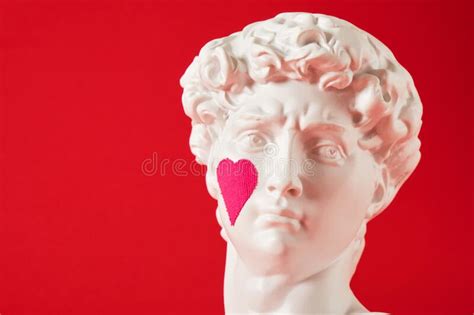 A Copy of the Head of an Antique Statue of David with a Pink Heart Pasted on the Cheek Stock ...