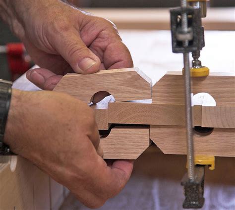 Clamp blocks force the boards to align perfectly for gluing up wide panels of solid wood ...