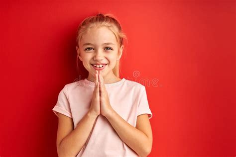Little Beautiful Child Girl Over Isolated Red Background Begging And Praying With Hands Together ...