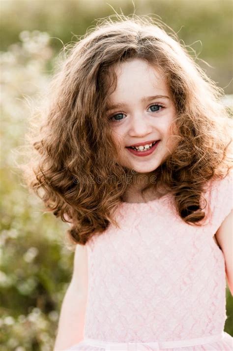 Portrait of a Smiling Charming Little Girl with Curly Hair Stock Image - Image of beautiful ...