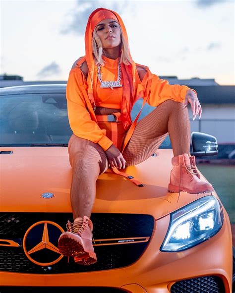 KAROL G Sure Knows How to Match Outfits With Wrapped Luxury SUVs and Supercars - autoevolution