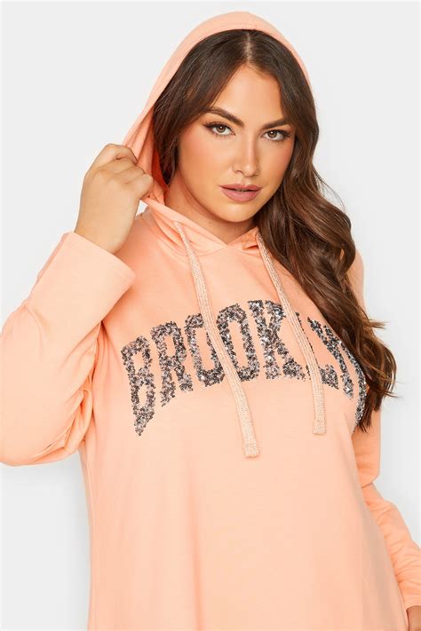 YOURS Plus Size Curve Light Orange 'Brooklyn' Slogan Longline Hoodie | Yours Clothing