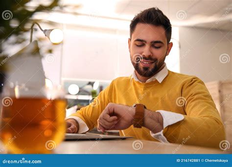 Man Working with Laptop at Table in Cafe Stock Image - Image of drink, online: 216742881