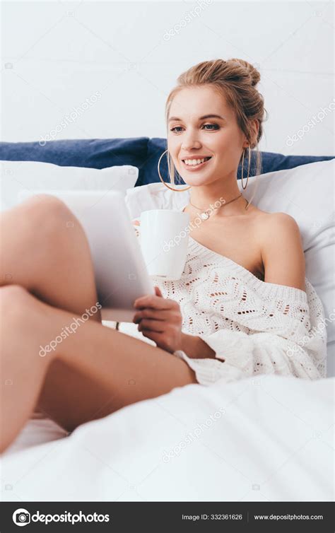 Beautiful Smiling Woman Cup Coffee Using Digital Tablet Bed Stock Photo by ©AndrewLozovyi 332361626