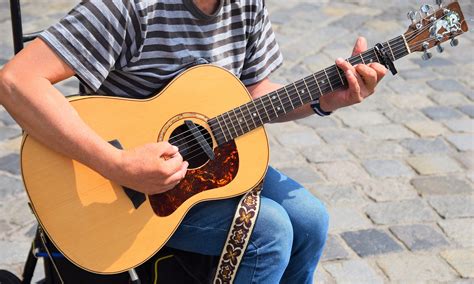 Photo of Person Playing Acoustic Guitar · Free Stock Photo