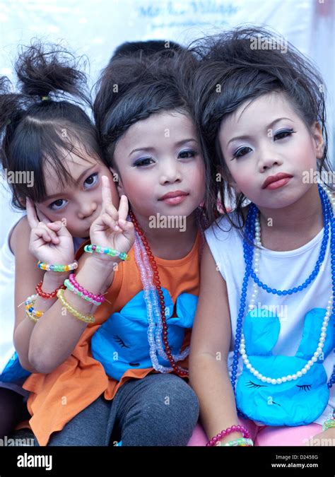 Child Makeup. Three young Thai girls wearing face make up for a children's day event. Thailand S ...