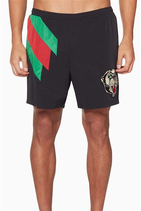 Shop Gucci Black Black Tiger Appliqué Swim Shorts for Men | Ounass Oman