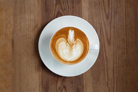 Top view latte art coffee on wood background 11043675 Stock Photo at ...