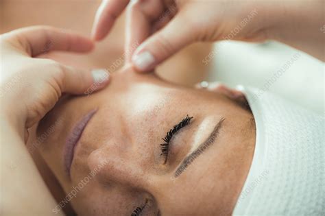 Face lifting massage - Stock Image - F037/5420 - Science Photo Library